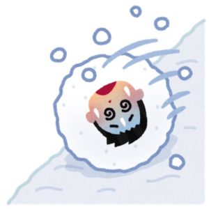 雪だるま式に坂道を転がっていく男性