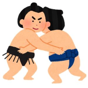 お相撲さんががっぷりよつに組んでいる
